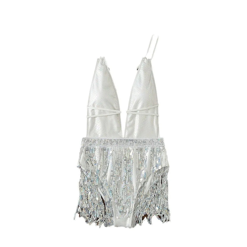 White one-piece swimsuit with a deep V-neckline and a tassel detail.