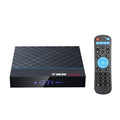 Black T95 Max Plus Android Smart TV Box with remote control on a wooden surface.