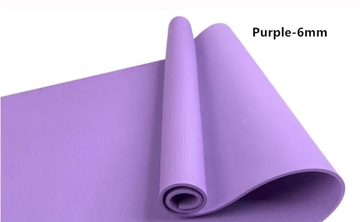 EVA foam yoga mat in blue, showing textured anti-slip surface, with a black OPP storage bag beside it.