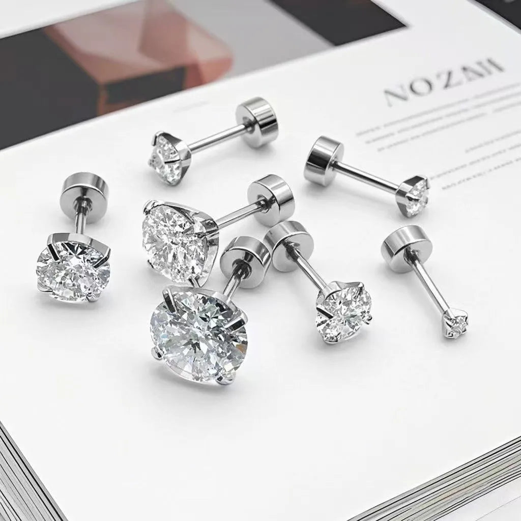 Titanium steel ear studs with flat bottom screw back, crown inlaid zircon, gold finish on white background