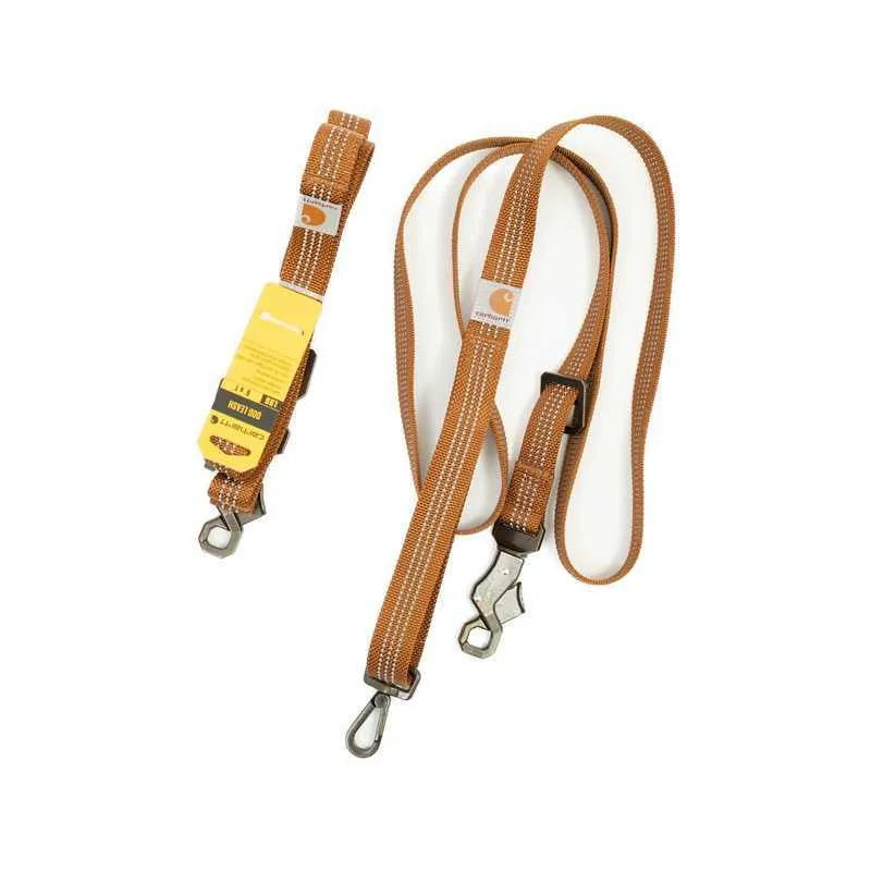 Dog wearing adjustable chest strap training belt with reflective hand holding rope attached