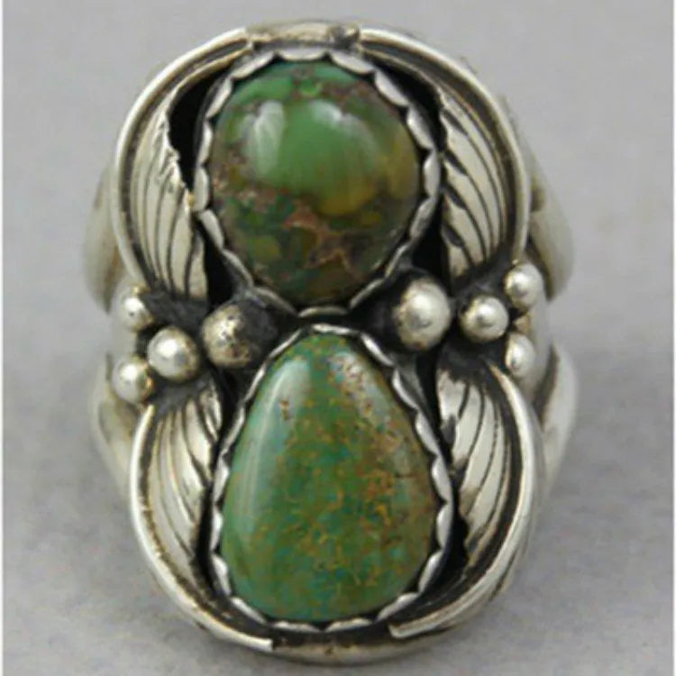 Retro geometric women's ring with a turquoise colour inlay on an electroplated alloy band.