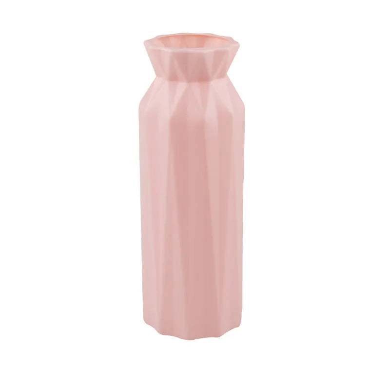 Green melamine drop-resistant vase with a wide base on a wooden table