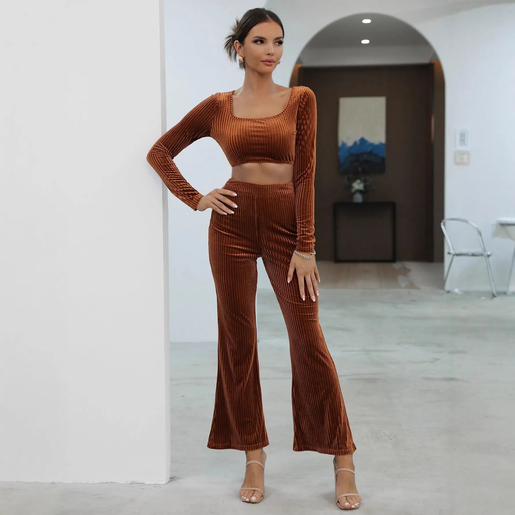 Caramel coloured long sleeve sweater and trousers casual set on a hanger