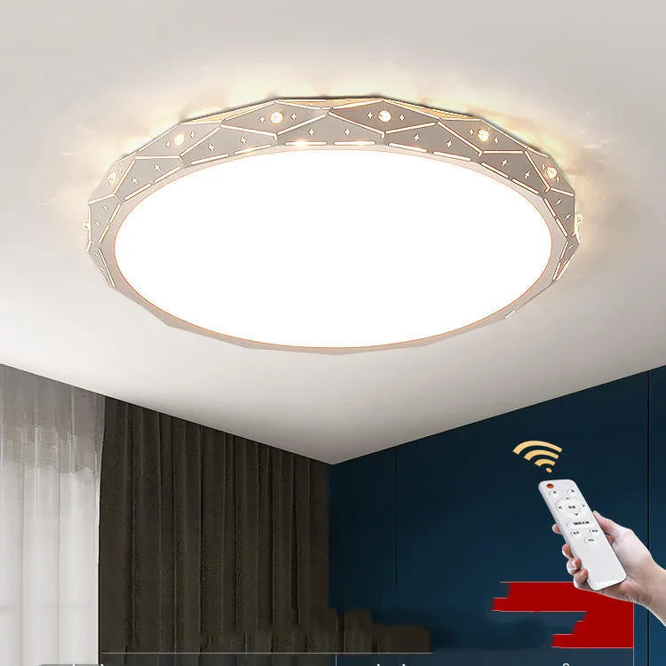 Round black iron frame LED ceiling light on a white ceiling.