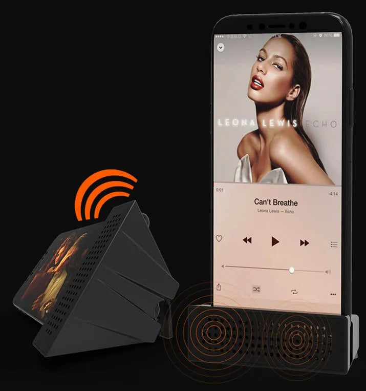 Mini black mobile phone amplifier bracket holding iPhone on desktop surface