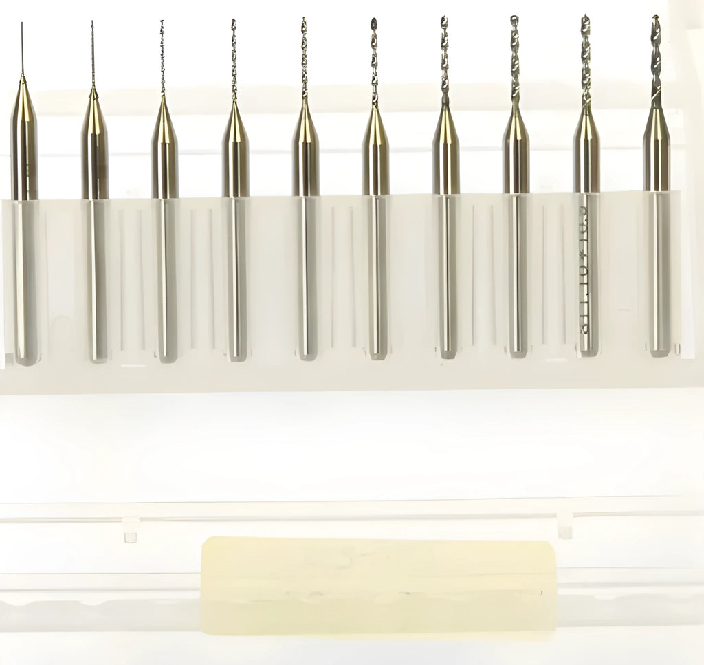 Close-up of a set of imported tungsten carbide micro-engraving bits in various sizes from 0.10mm to 2.00mm diameter.