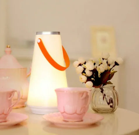 White rechargeable LED table lamp with square base and warm light illumination