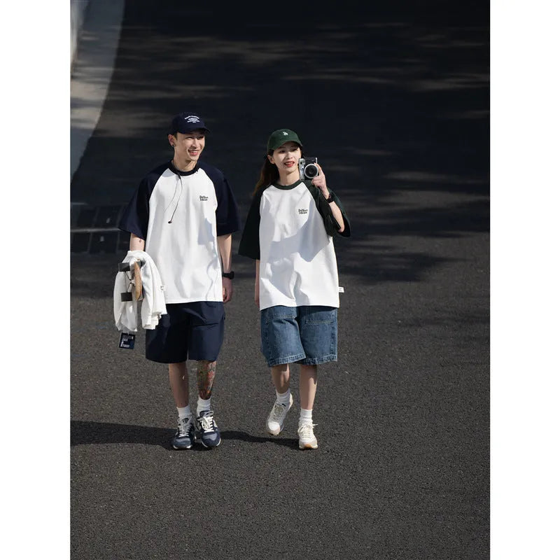 Man wearing a loose-fit grey raglan sleeve T-shirt, Japanese casual style.