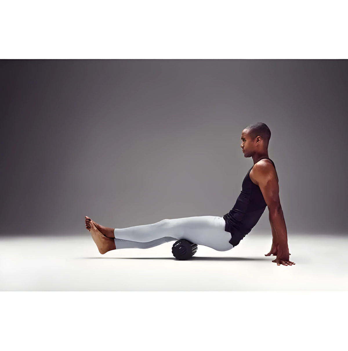 Black 4 speed vibrating foam massage roller, 800g, for post-exercise muscle massage