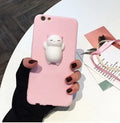 A soft pink silicone iPhone case with a raised 3D cartoon cat design on the back.