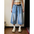 A pair of men's light blue denim shorts with a loose straight-leg cut on a neutral background.