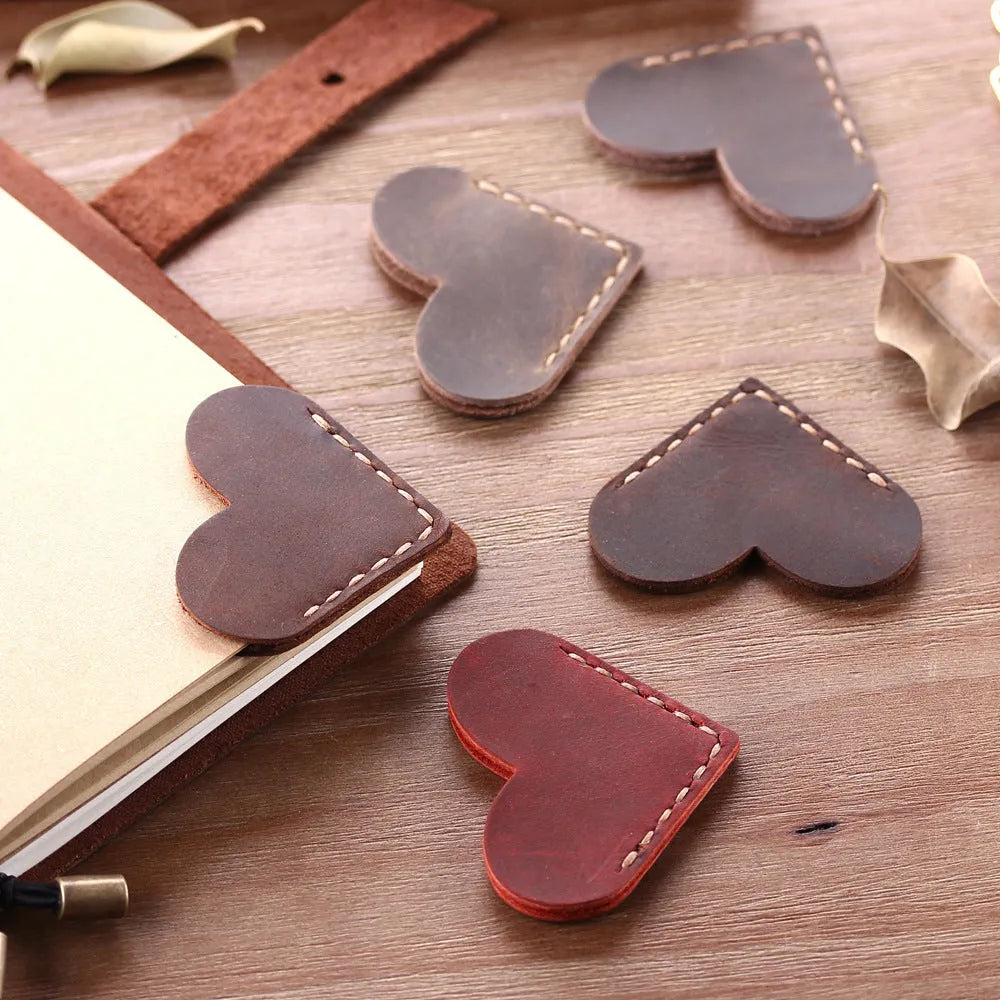 Heart-shaped bookmark in brown crazy horse leather with textured surface and handmade edges