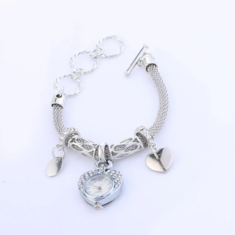 Ladies Love bracelet watch with 2.6cm dial, 23.5cm strap, 50g, in golden or silvery finish