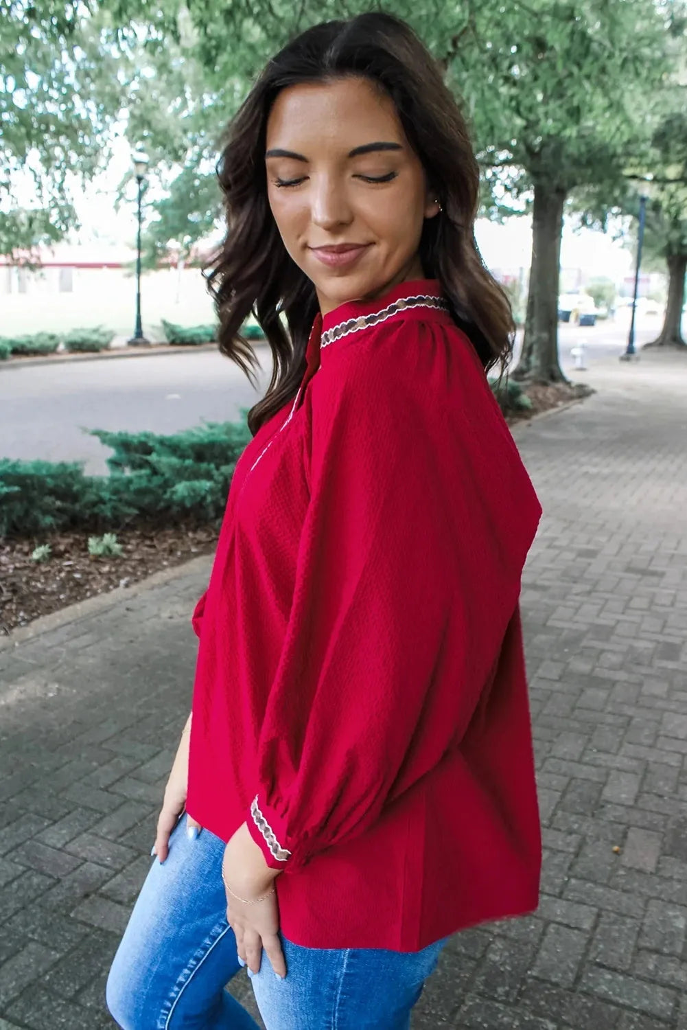 Women's red polyester pullover shirt with embroidered collar and printed design, loose fit