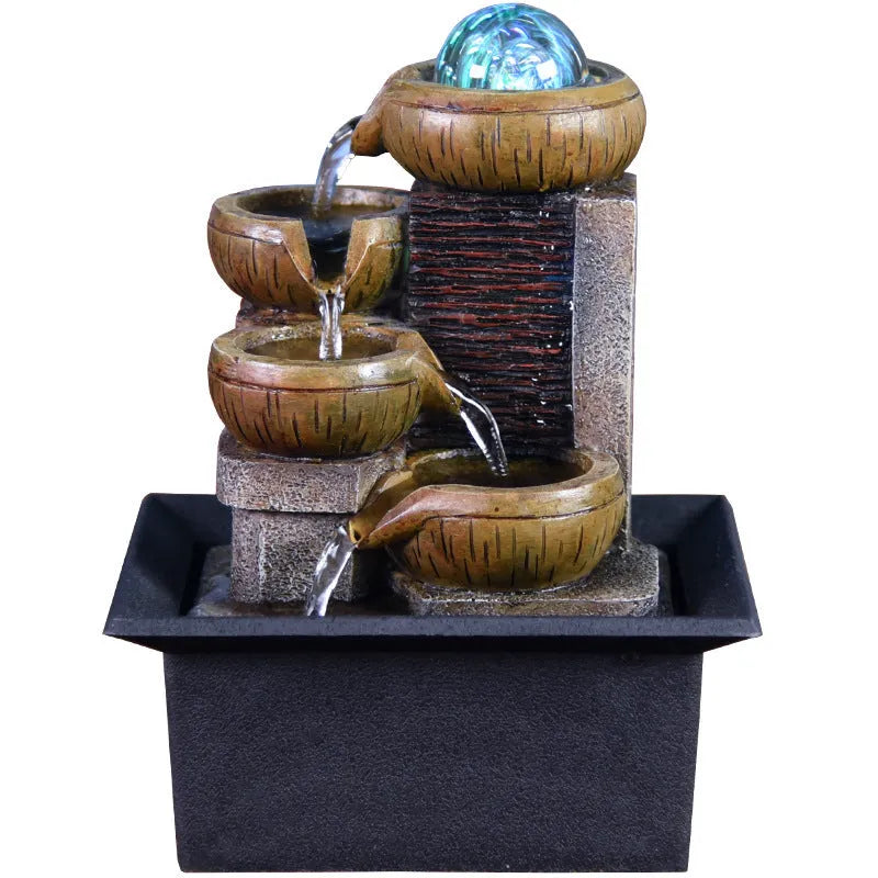 European desktop fountain with resin stone powder construction, crystal ball, and flowing water on a desk