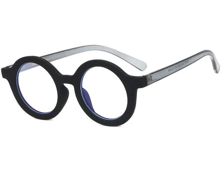Retro round glasses with plastic frames in leopard print colour and clear lenses.