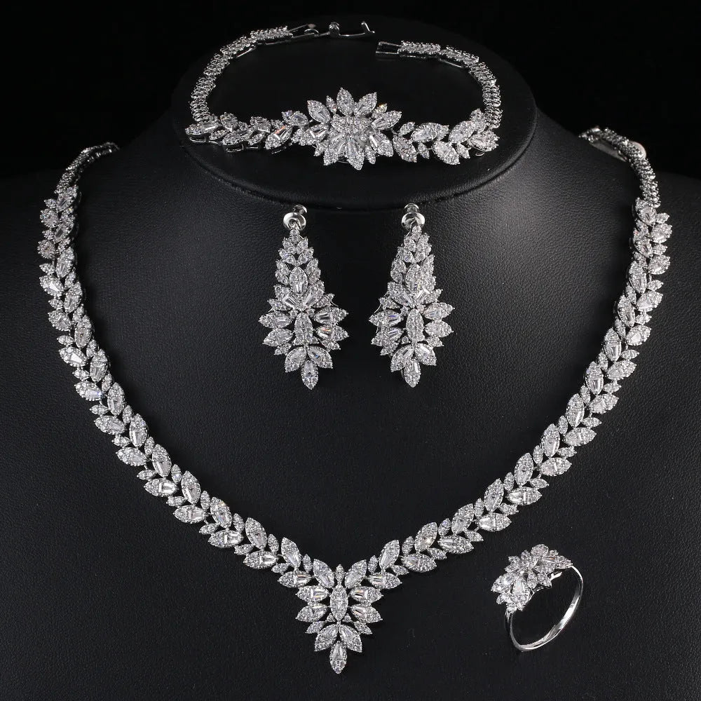 White copper bridal jewellery set with tassel earrings, necklace, bracelet, ring and snake bone chain