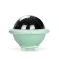 Green UFO-shaped plastic night light projecting a starry sky pattern on a wall.