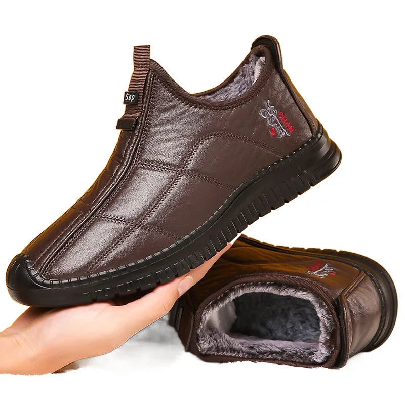 Men's brown winter cotton boots with a buckle closure and a thick, treaded non-slip sole.