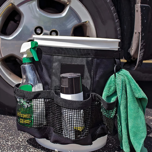 Black cylindrical polyester storage bag mounted on 5 gallon barrel with carry handles visible