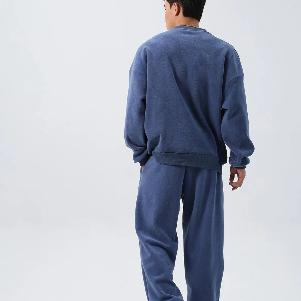 Men's polar fleece suit set showing crew neck jacket and padded trousers in five winter colour options
