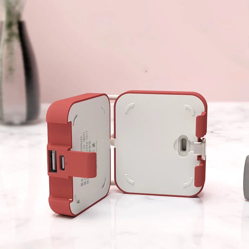 Handbag back clip power bank with flip-out phone stand, shown in blue, green, red, and white colour options.