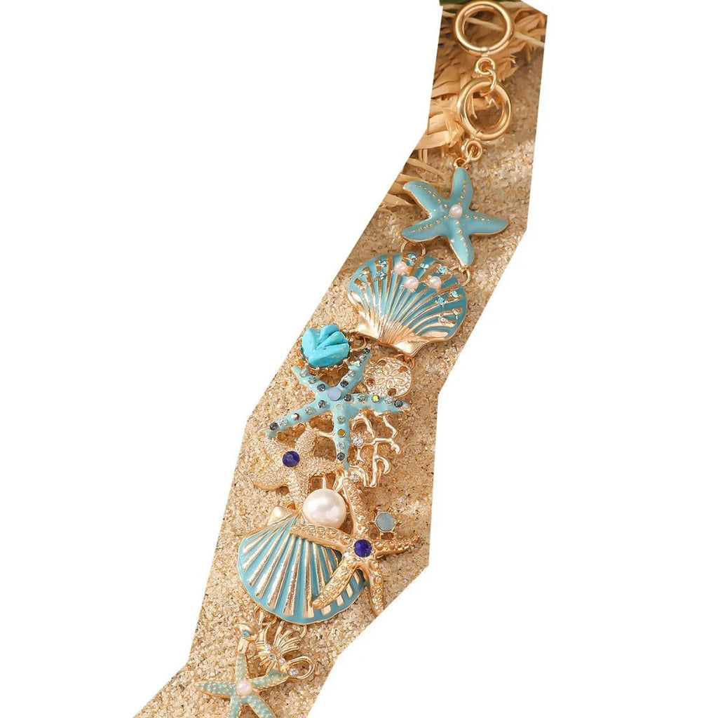 Alloy marine charm bracelet with shell, starfish, and anchor design in turquoise, red, or blue.