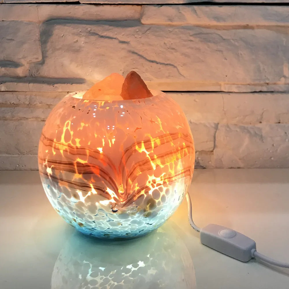 Glass night light with USB cable on a wooden bedside table, 13cm height and width