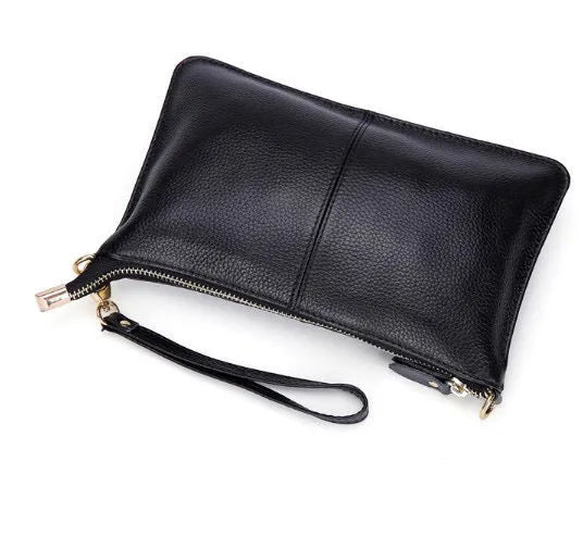 Lady cowhide slant bag showing compact design with hand strap and shoulder strap options