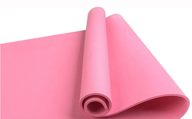 EVA foam yoga mat in blue, showing textured anti-slip surface, with a black OPP storage bag beside it.