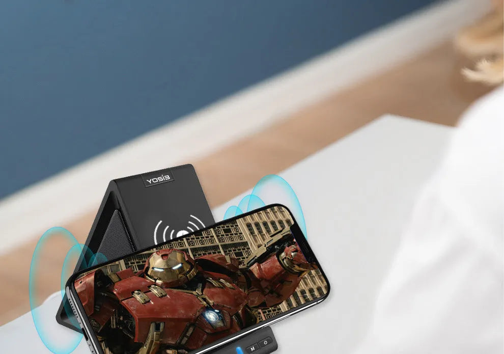 Black multifunctional Bluetooth speaker with built-in power bank and phone stand, showing front and side views.