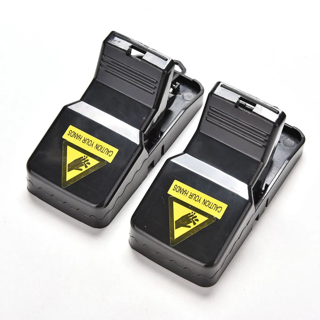 Six black plastic snapping mousetraps with measurements 11cm long by 5.5cm high