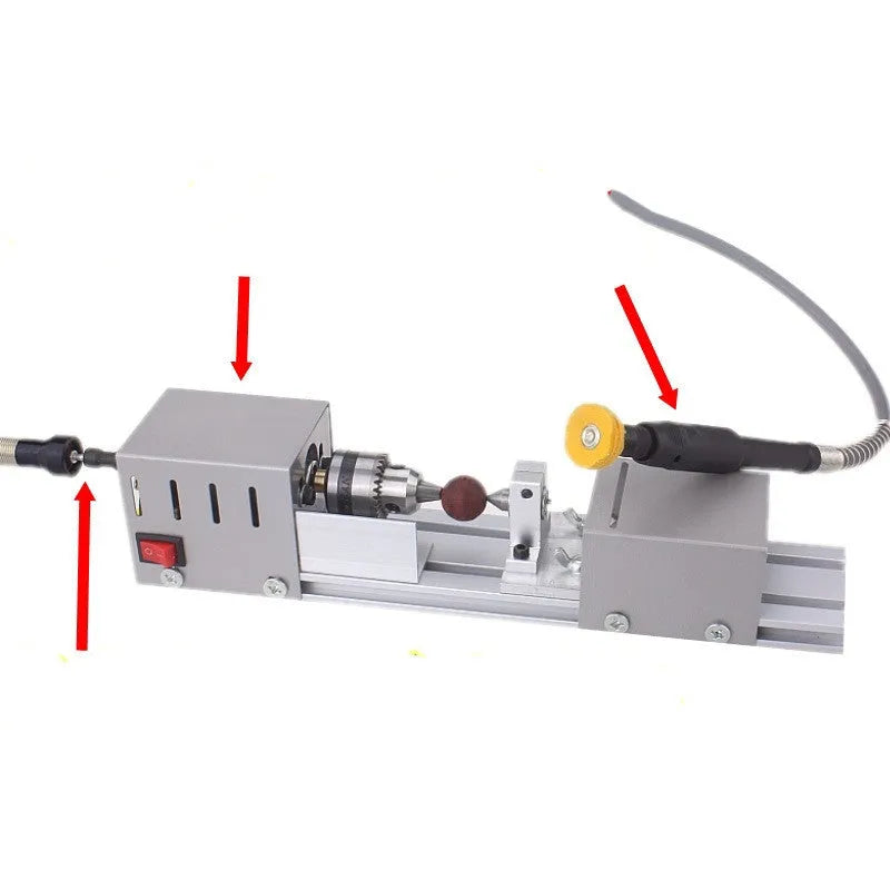 Silver metal mini woodworking lathe with six carving knives on workbench