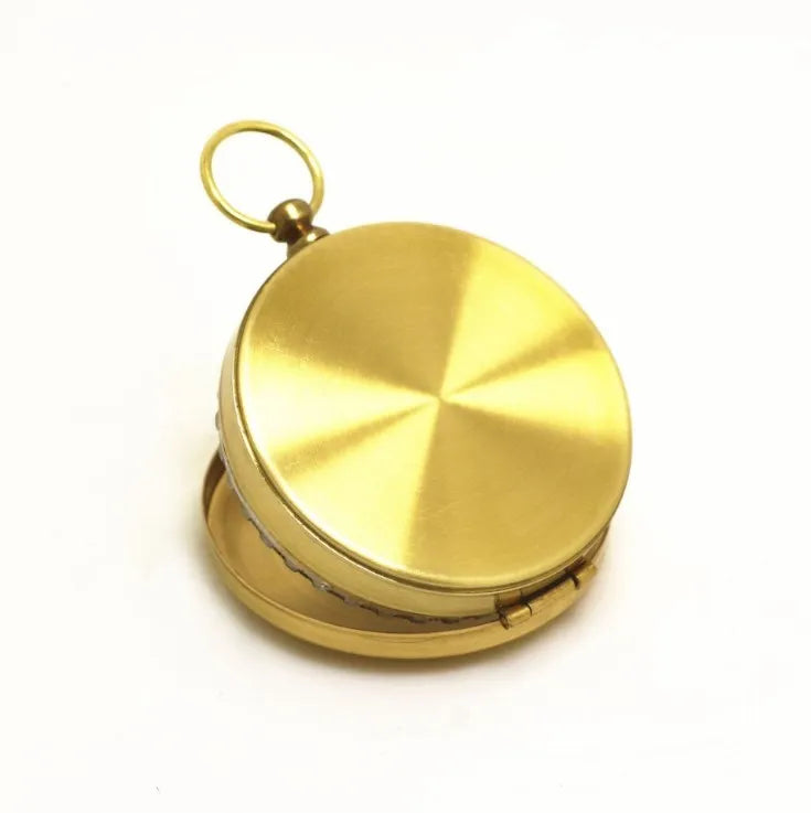 Metal flip compass outdoor pocket watch compass gold colour copper-tone close-up