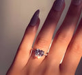White gold alloy heart-shaped ring with AAA zircon stone on a light background