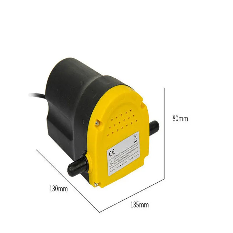 Yellow electric oil pump with cast aluminium body and 1.2m inlet pipe on a workshop bench