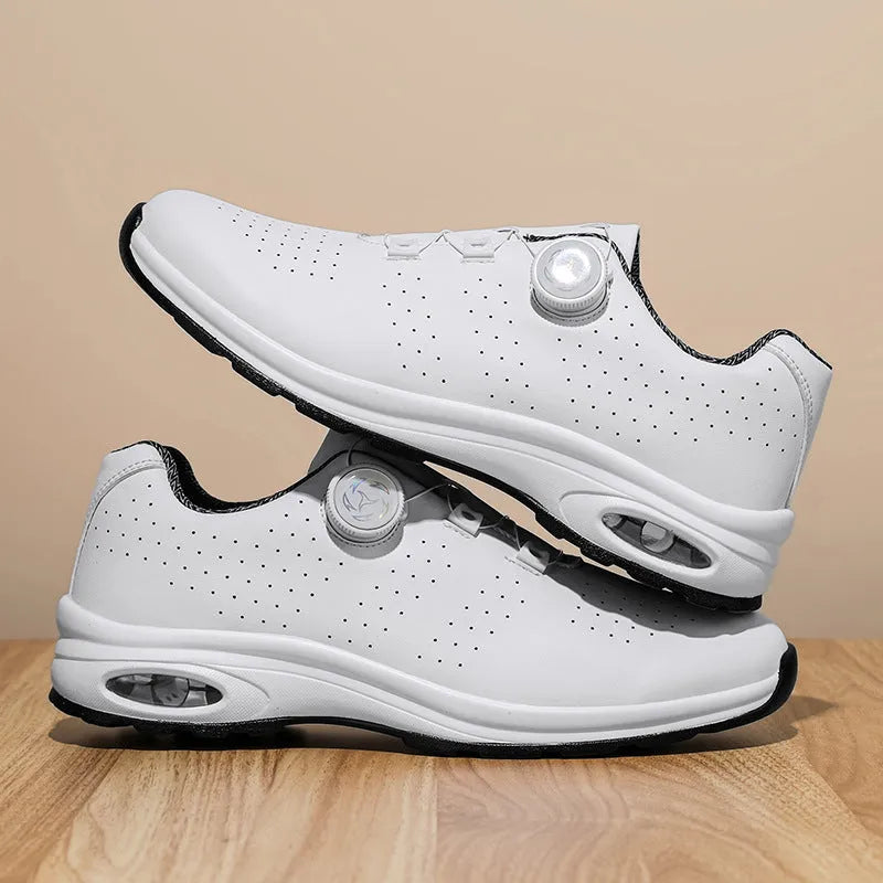 Black and white low-top mesh casual tennis shoes with cross shoulder straps and flat soles.