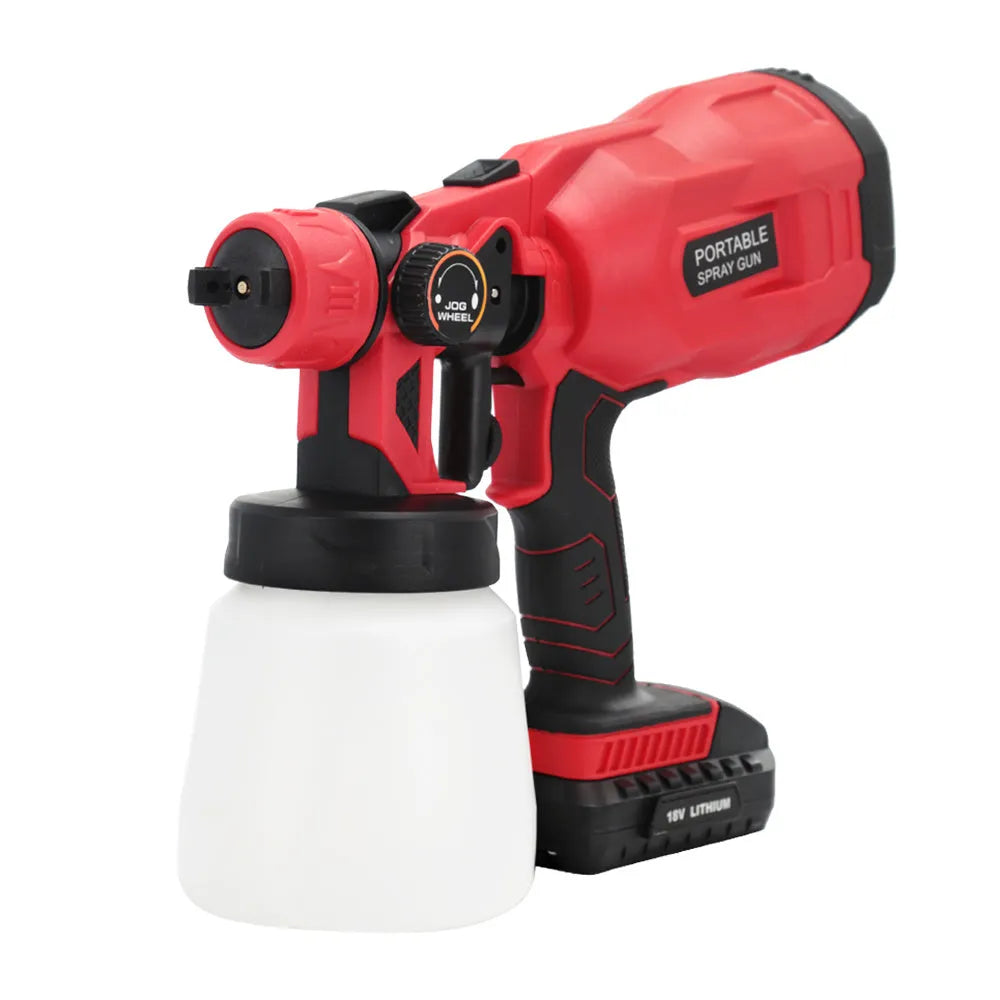 Blue cordless automatic paint spray gun with 800ml can and 1.8mm nozzle on a workbench.
