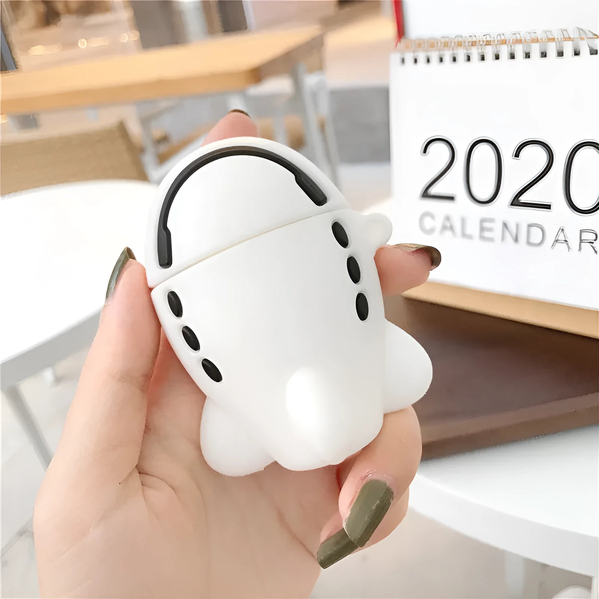 AirPods silicone protective case with cartoon aircraft headset design and keychain hook