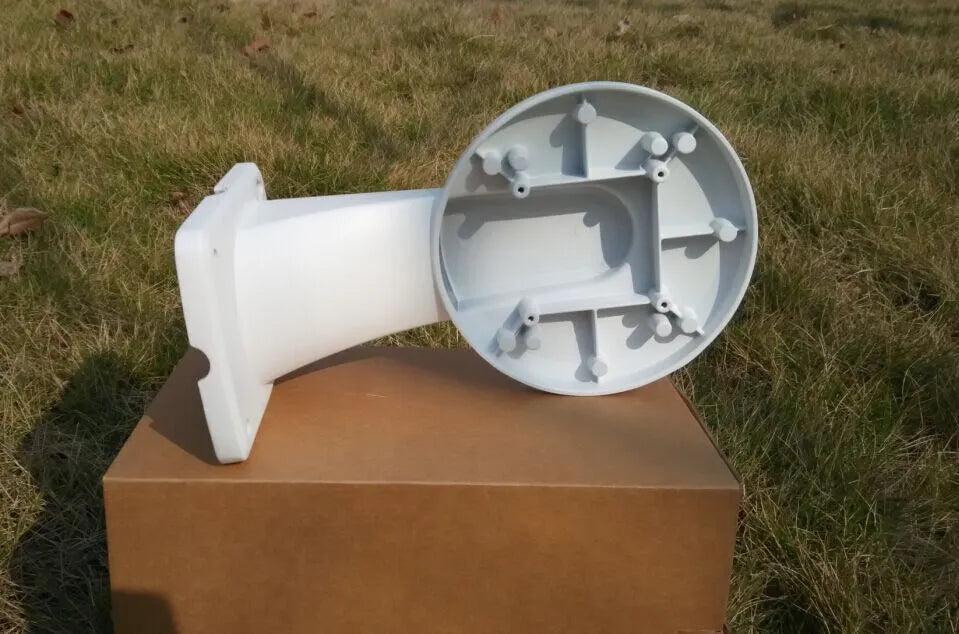 White aluminium alloy and ABS dome camera wall mount bracket on a white wall