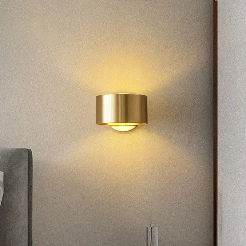 Modern simple style copper wall lamp in a choice of black or gold finish.