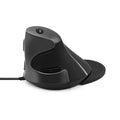 Black and white ergonomic vertical mouse with wired USB cable on a desk.