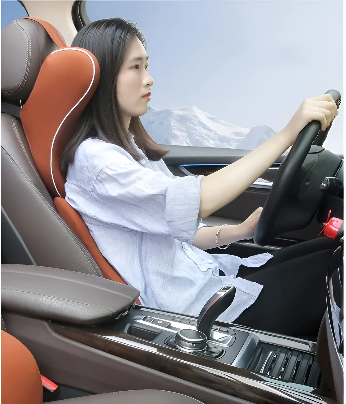 Car headrest and lumbar support cushion set in gray on a car seat