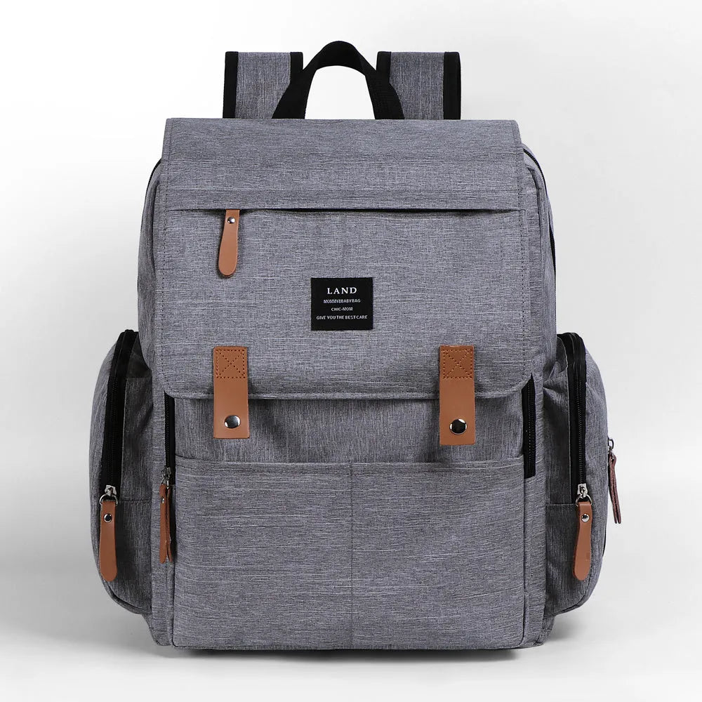 LAND Mommy large capacity oxford cloth diaper backpack with changing mat in beige colour.