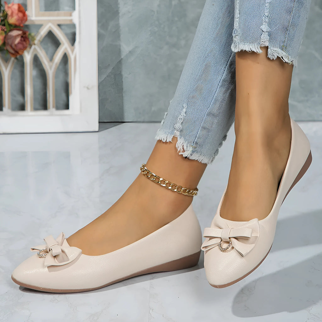 Women's beige flat casual shoes with a bowknot on the shallow mouth and a round toe.