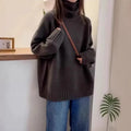 Women's loose thick turtleneck sweater in red with curling pile collar and textured mesh fabric