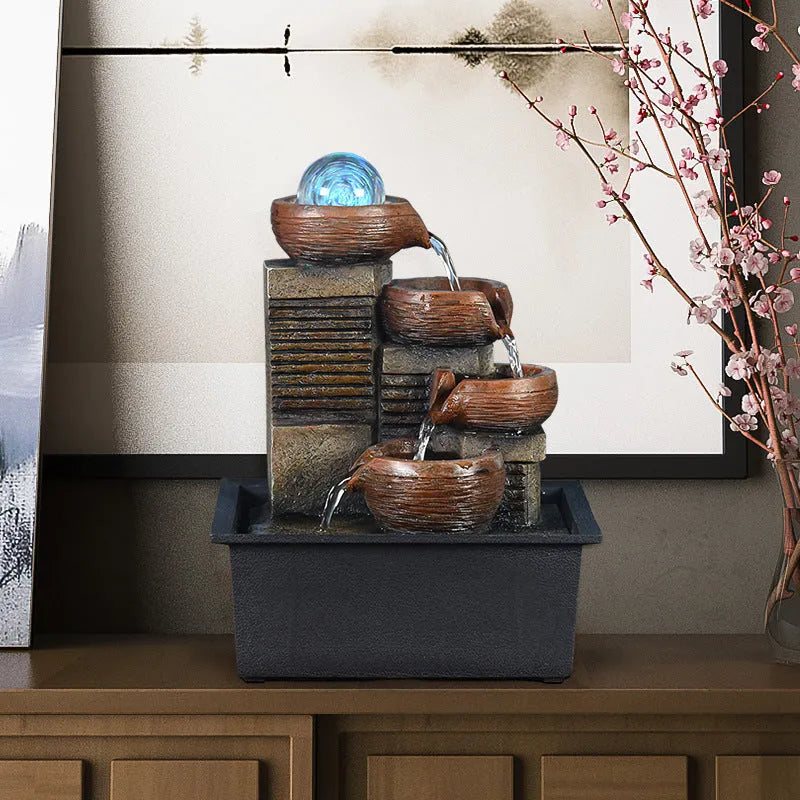 European desktop fountain with resin stone powder construction, crystal ball, and flowing water on a desk