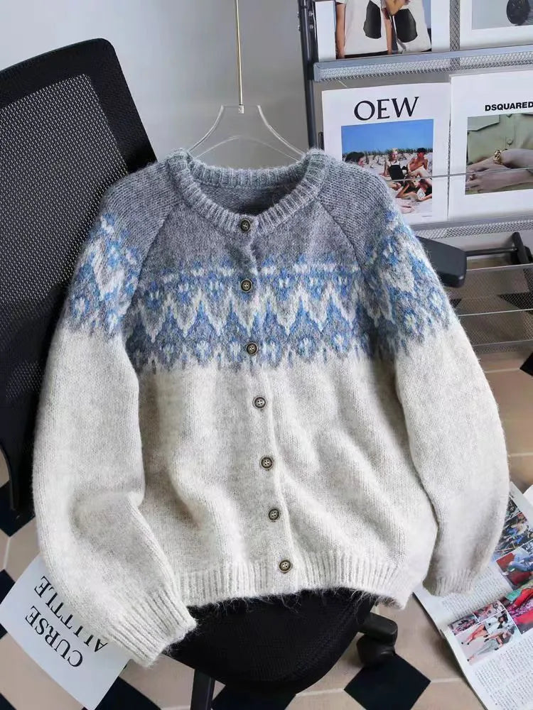 Women's loose-fit jacquard knit sweater coat in milky white, shown on a hanger.