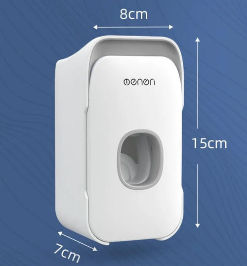 Automatic wall-mounted toothpaste dispenser in blue colour on a bathroom wall.